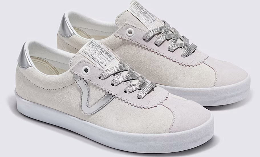 pair of white suede and silver sneakers