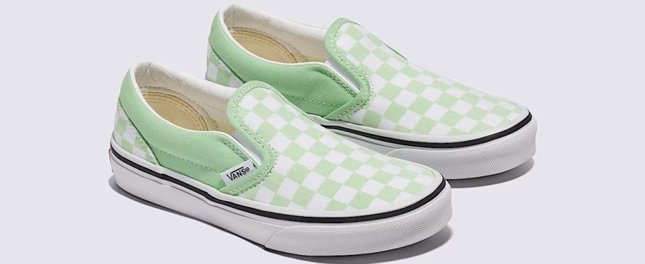 pair of green and white checkerboard sneakers