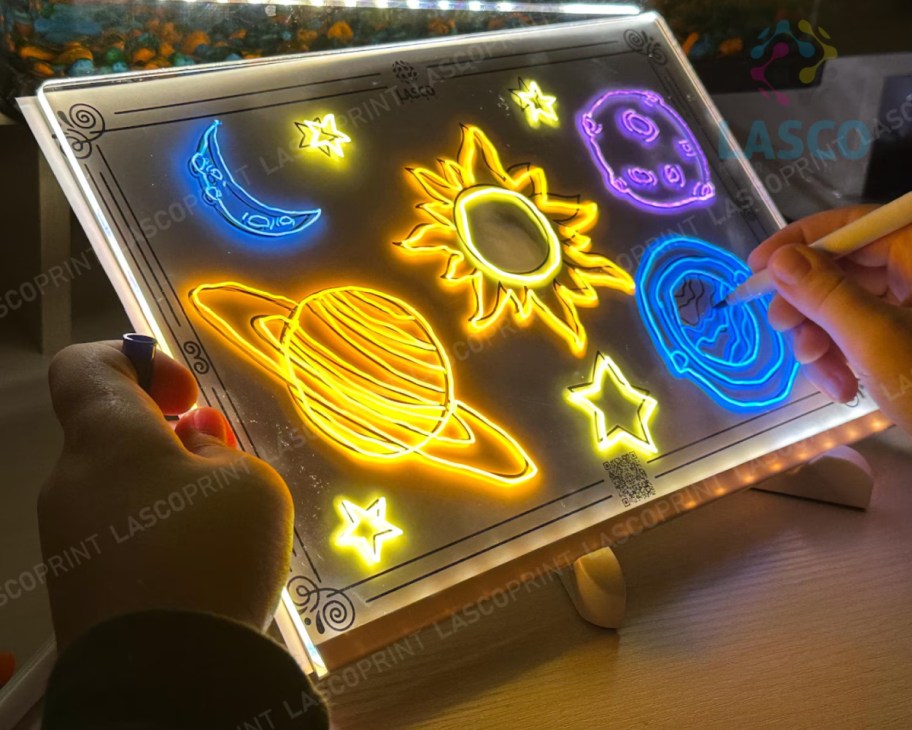 drawing board with lights and space pics