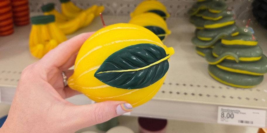 hand holding lemon candle