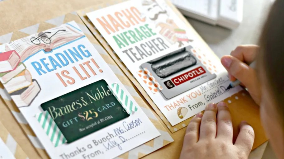 girl writing on gift card for teacher gift