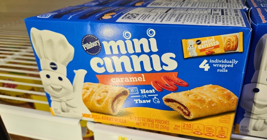 a box of Pillsbury Mini Cinnis breakfast bars in the fridge section at Walmart