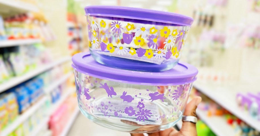 hand holding stack of spring print glass food storage containers