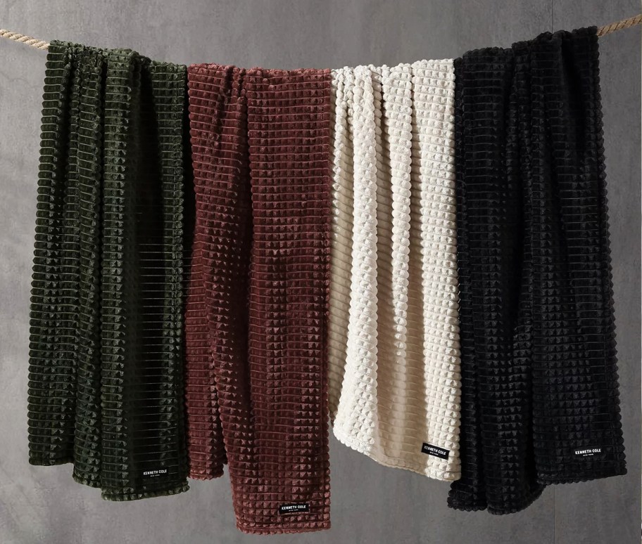 throw blankets hanging on a rope