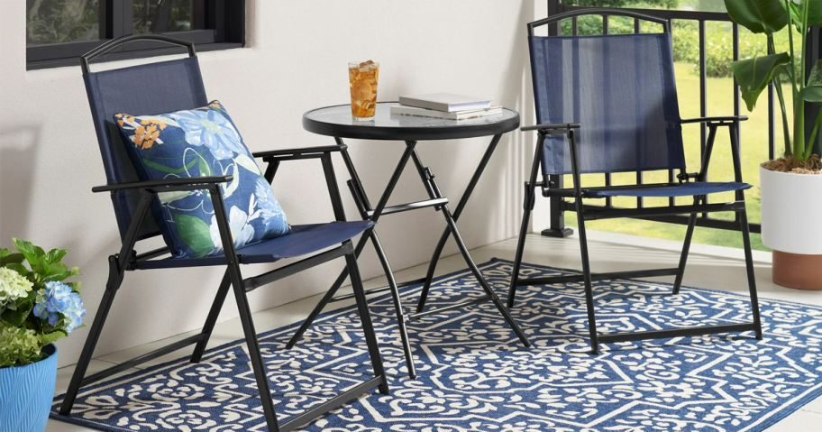 blue patio chairs with glass bistro table