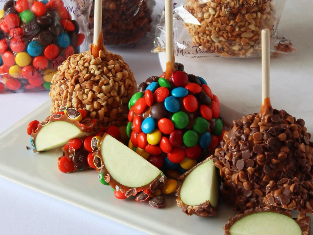 Candy coated, caramel apples on platter