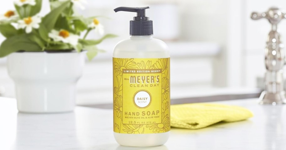 yellow bottle of Mrs. Meyer's Hand Soap near sink