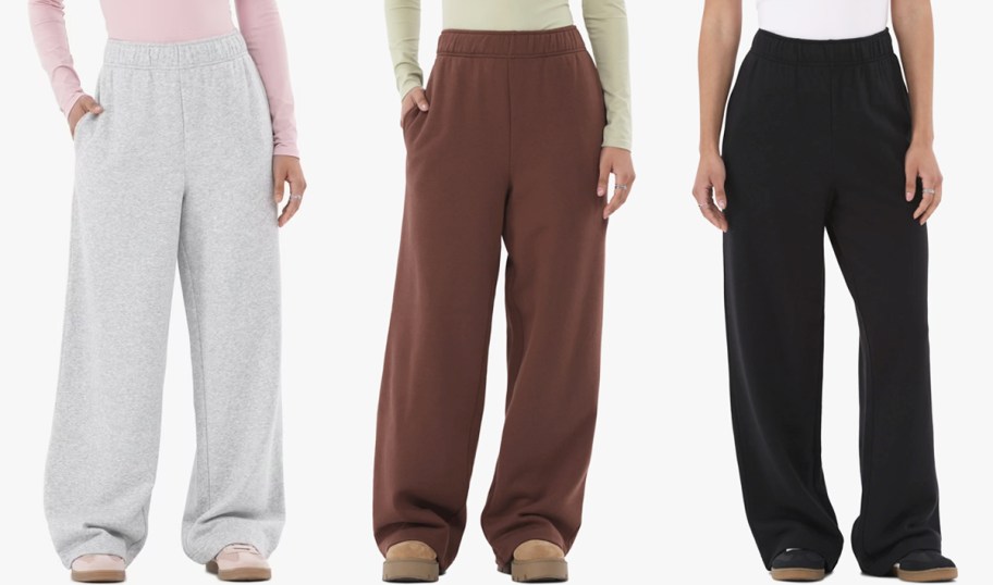 three women in grey, brown, and black sweatpants