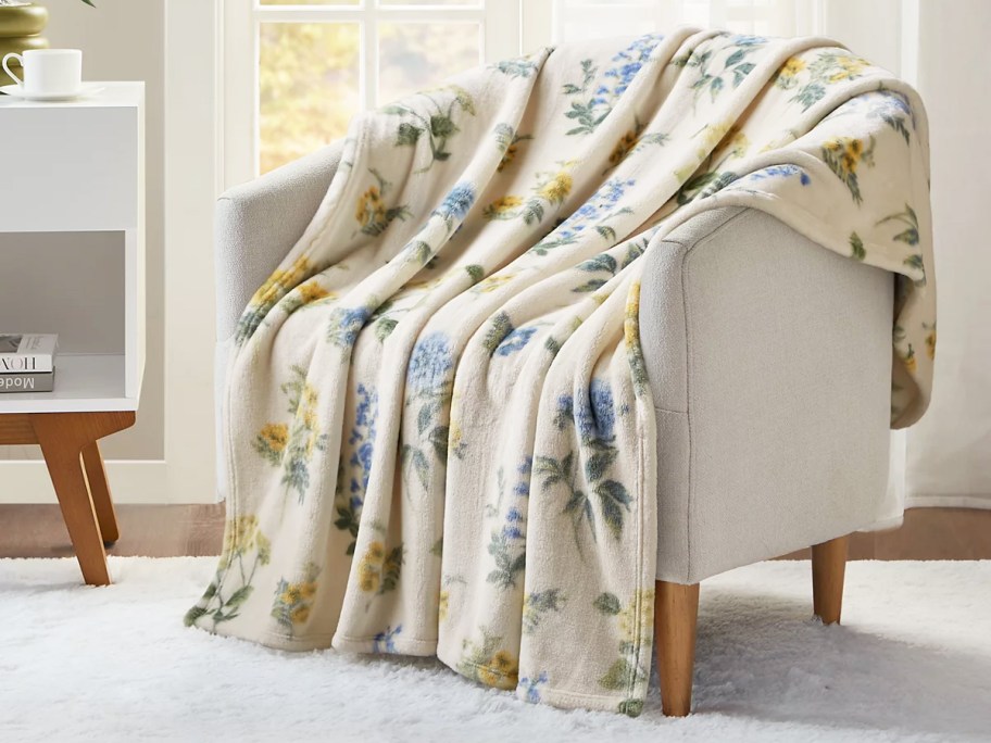 floral print throw blanket draped over a chair