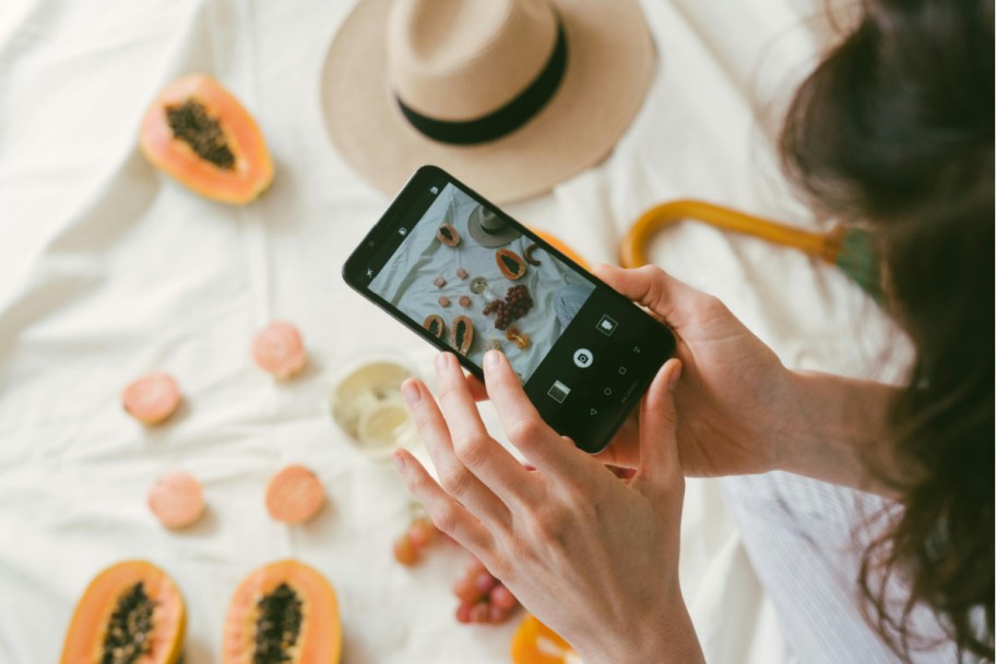 person taking picture of food