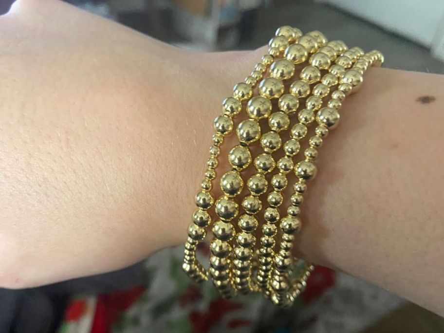 woman wearing gold Dodder Bracelet Set on wrist