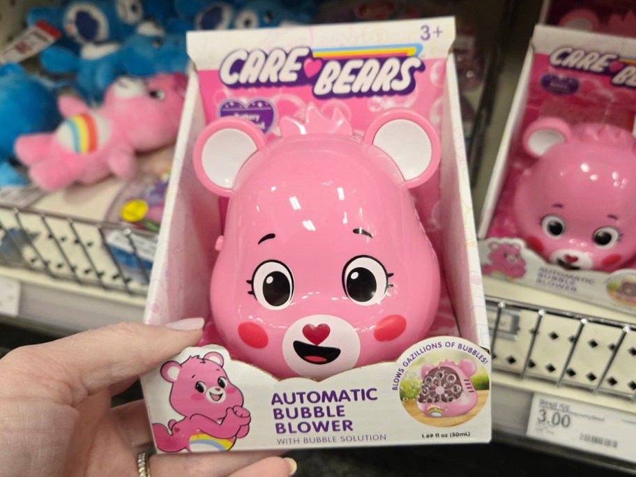 hand holding Care Bears bubble blower
