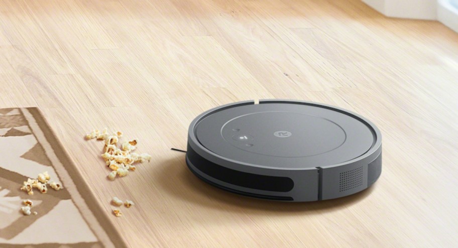 irobot cleaning the floor with popcorn infront of it 