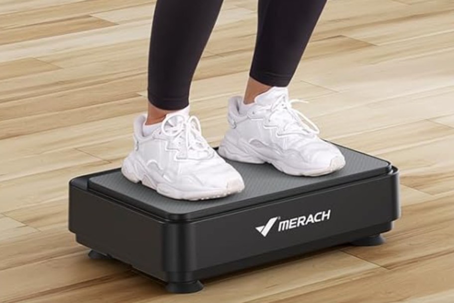 feet on vibrating exercise plate