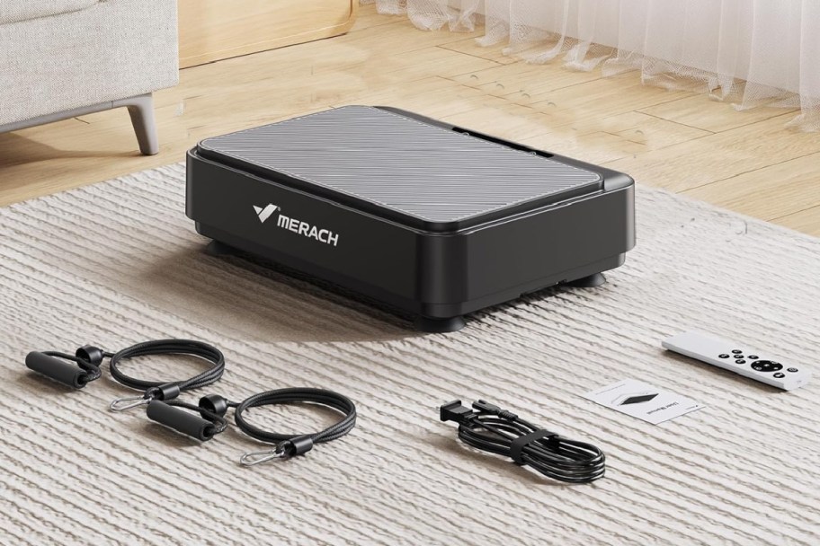 vibrating exercise plate on floor with exercise bands and remote