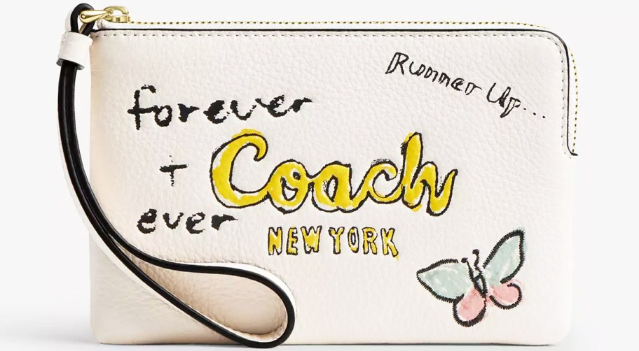 white wristlet with doodles on it