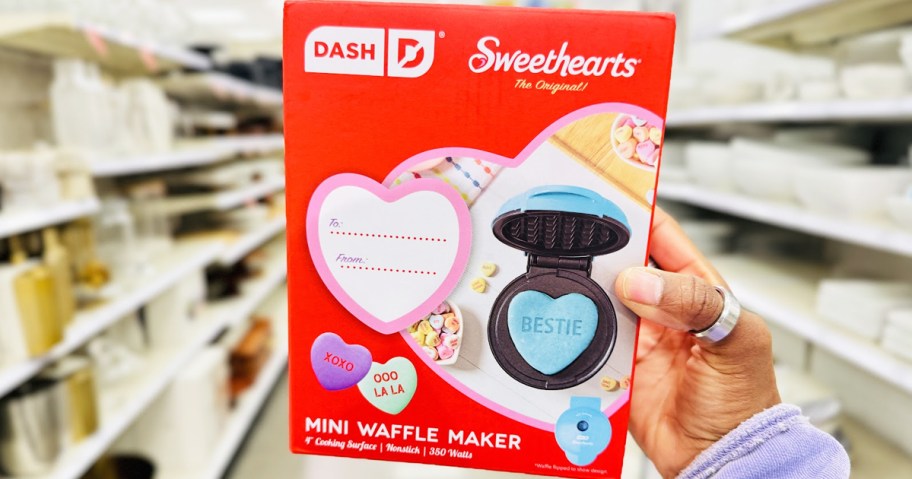 hand holding up Dash x Sweethearts Mini Waffle Maker box in store