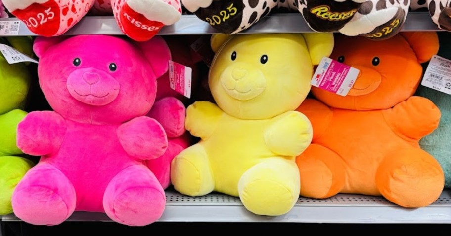3 large plush Gummy Bear animals on a store shelf