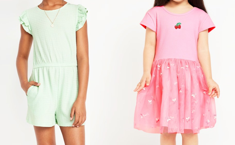 girl in green romper and girl in pink dress