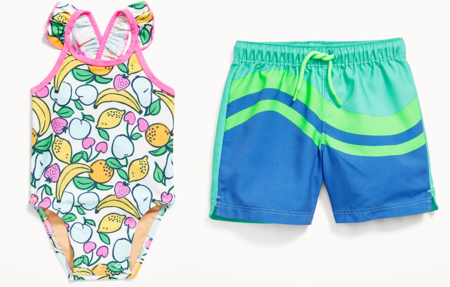 fruit print swimsuit and blue & green swim trunks