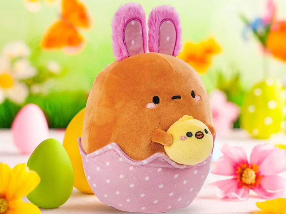 A plush bunny in an egg