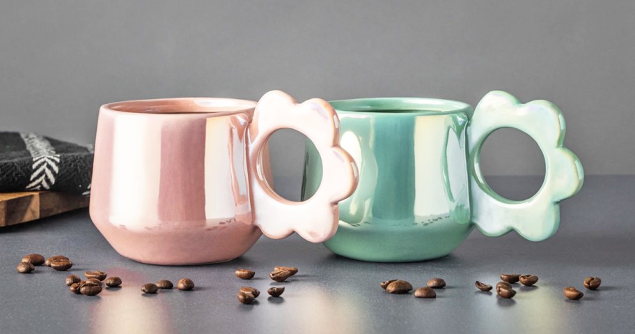 pink and green pearlescent coffee mugs with flower shaped handles