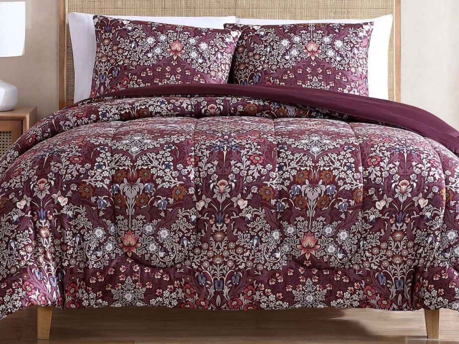 3 piece floral comforter set on a bed