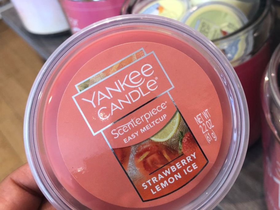 Hand holding a yankee candle easy melt cup