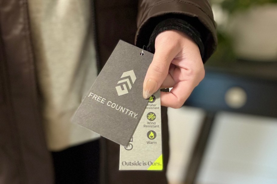 hand holding free country tag