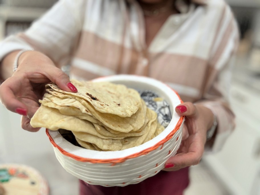 holding a basket of homemade tortillas