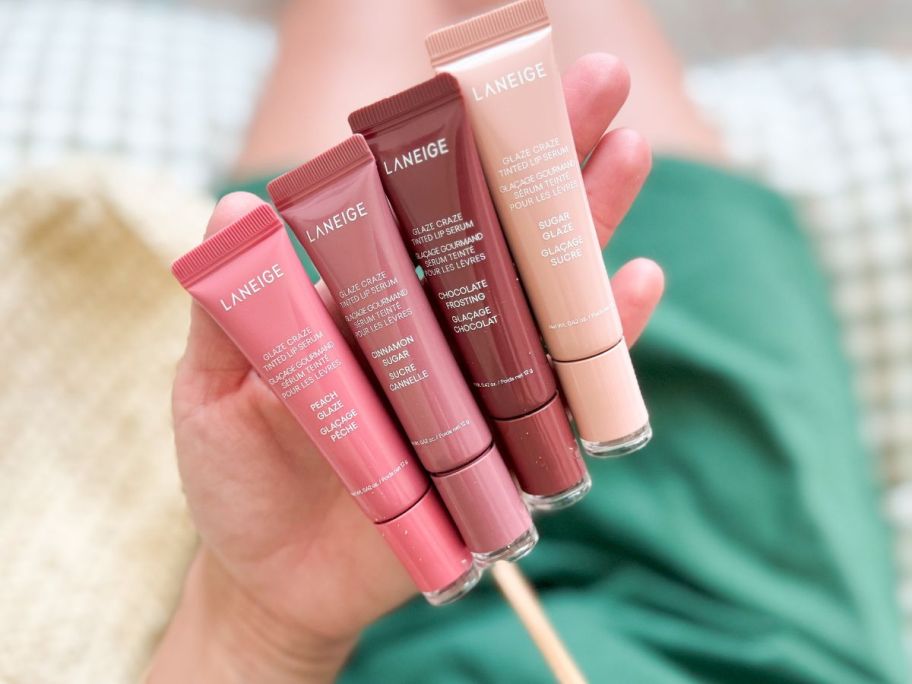 hand holding four Laneige Glaze Craze Tinted Lip Serums