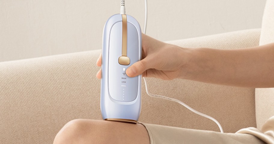 woman using lubex laser hair remover on leg