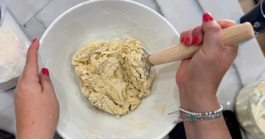 mixing tortilla dough in a bowl