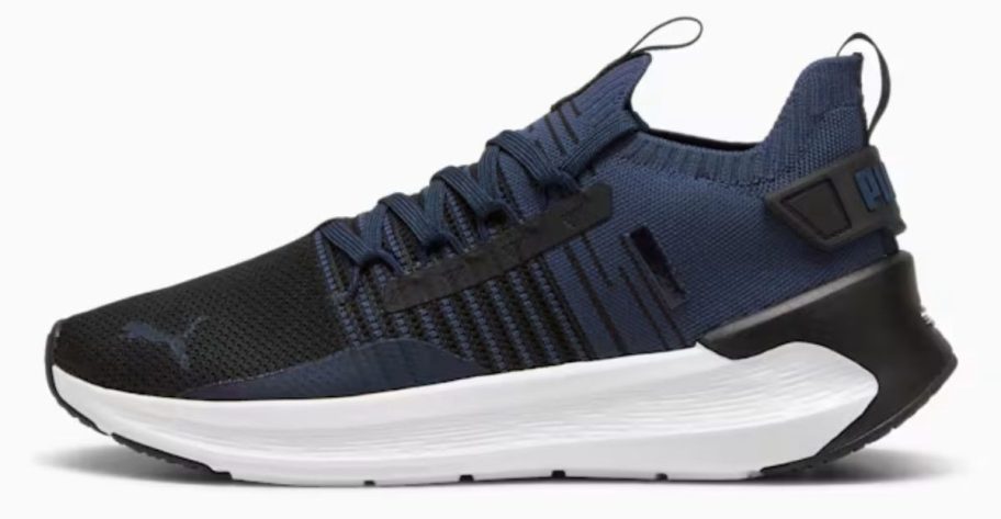 blue and white PUMA Men's Softride Symmetry Fuzion Shoe stock image