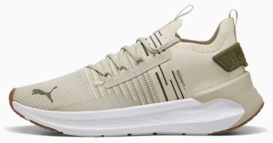brown and beige PUMA Men's SOFTRIDE Symmetry Fuzion Shoe stock image