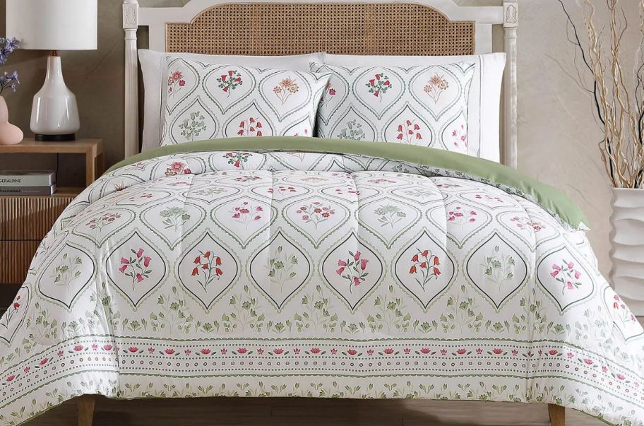 3 piece floral comforter set on a bed