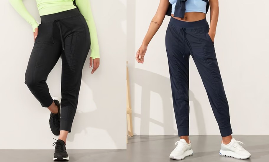 two women in black and navy blue joggers