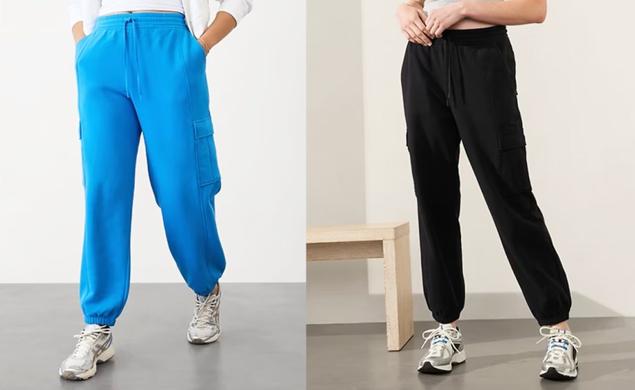 two women in blue and black cargo joggers