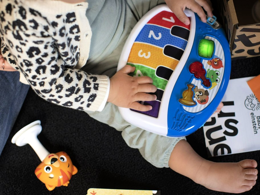 baby playing with Baby Einstein Music Toys