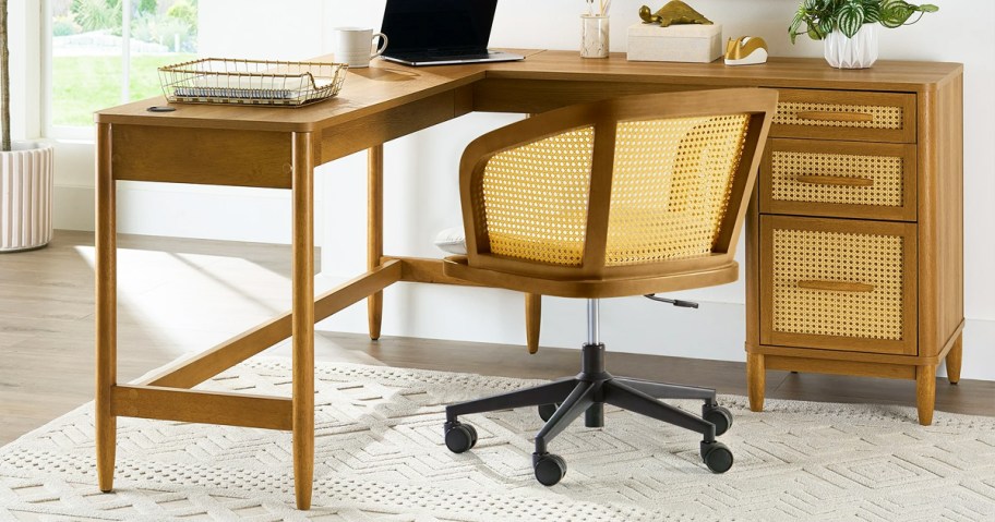 wood l-shaped desk with rattan drawers and matching task chair