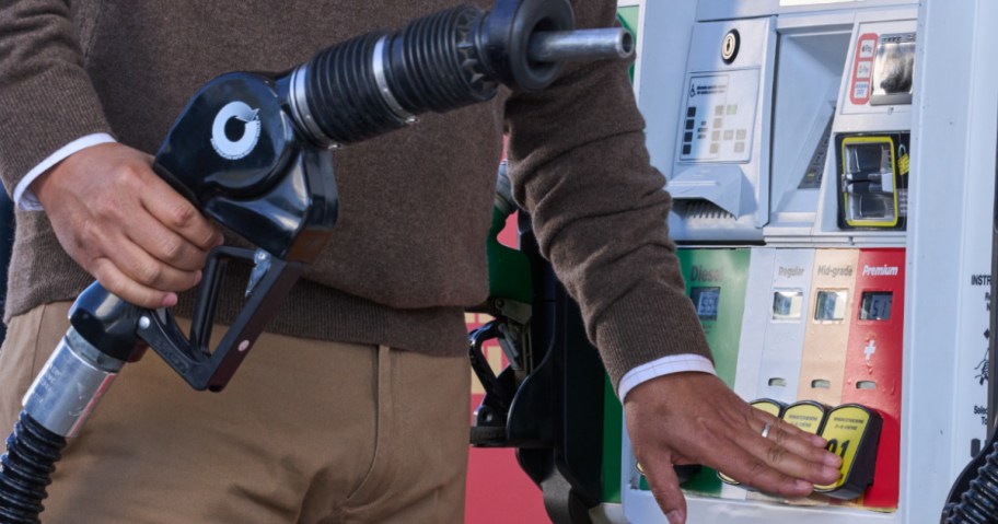 Man holding gas pump at Circle K