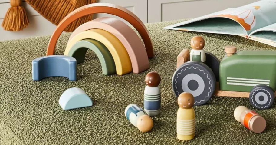 Hearth & Hand with Magnolia wooden rainbow stacker, people and tractor toys