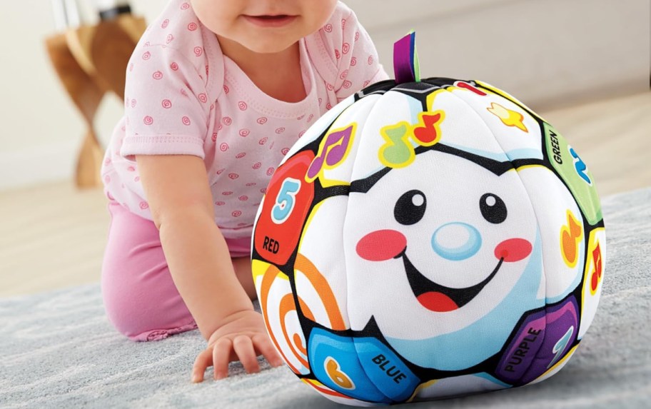 Kiddo playing with sound making ball