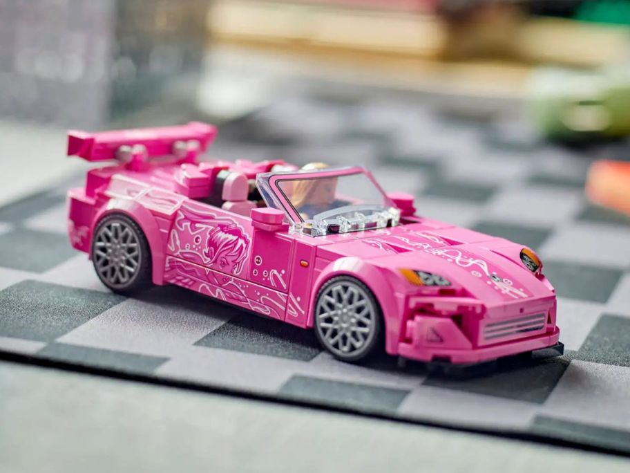 A pink LEGO 2 Fast 2 Furious Honda S2000 car