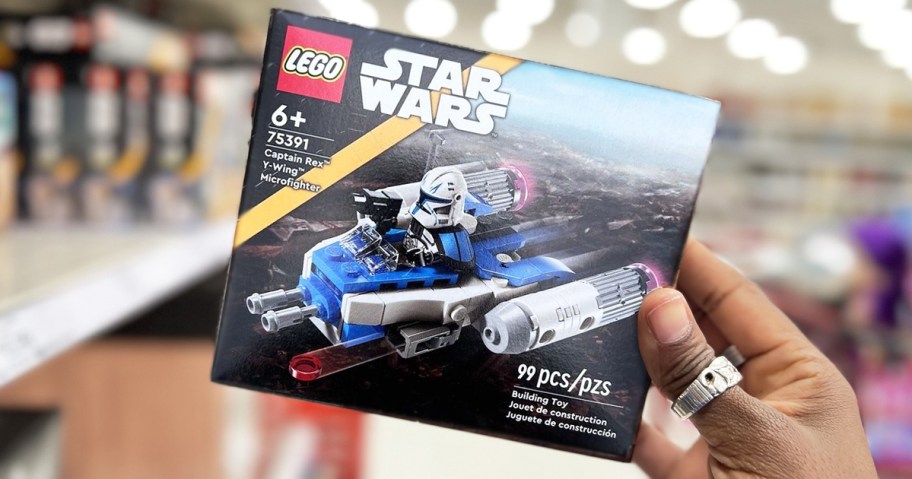 hand holding up box for LEGO Star Wars: The Clone Wars Captain Rex Y-Wing Microfighter in store