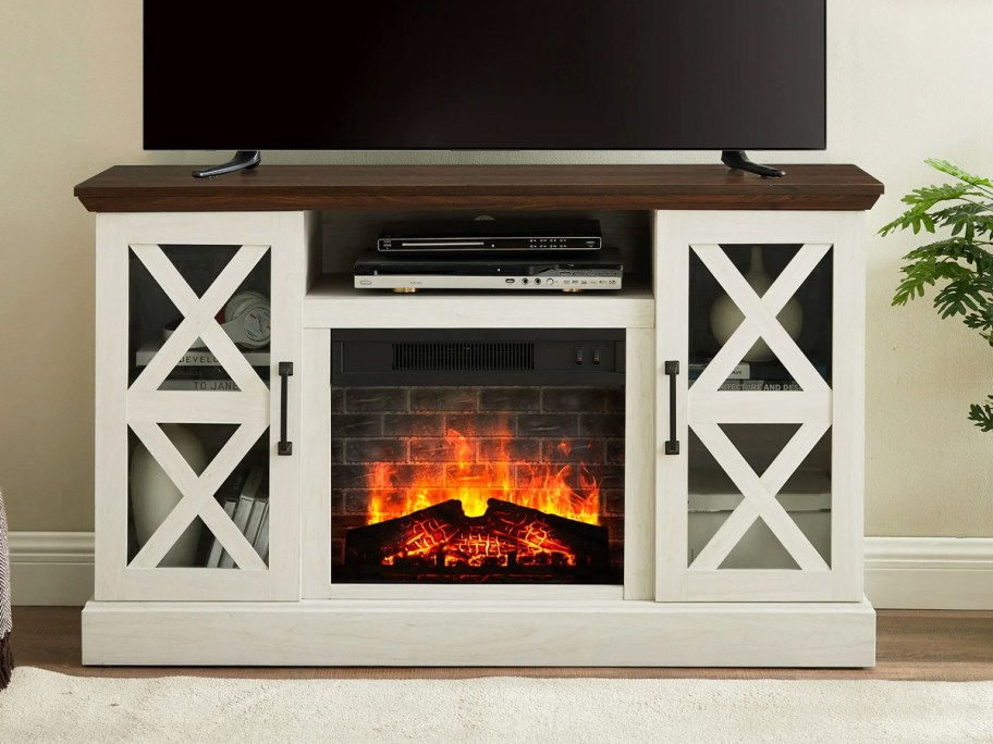 white fireplace tv stand with wood top