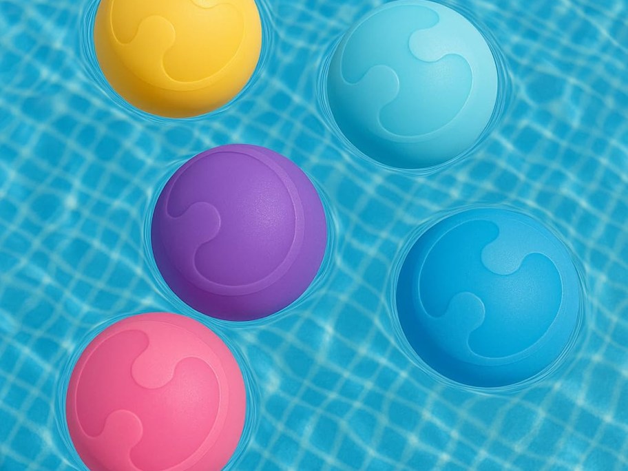 Bright reusable water balloons floating in a swimming pool, made of soft silicone and designed for outdoor water play.