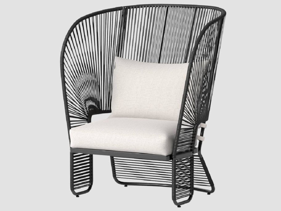 patio armless chair with white cushions on there 