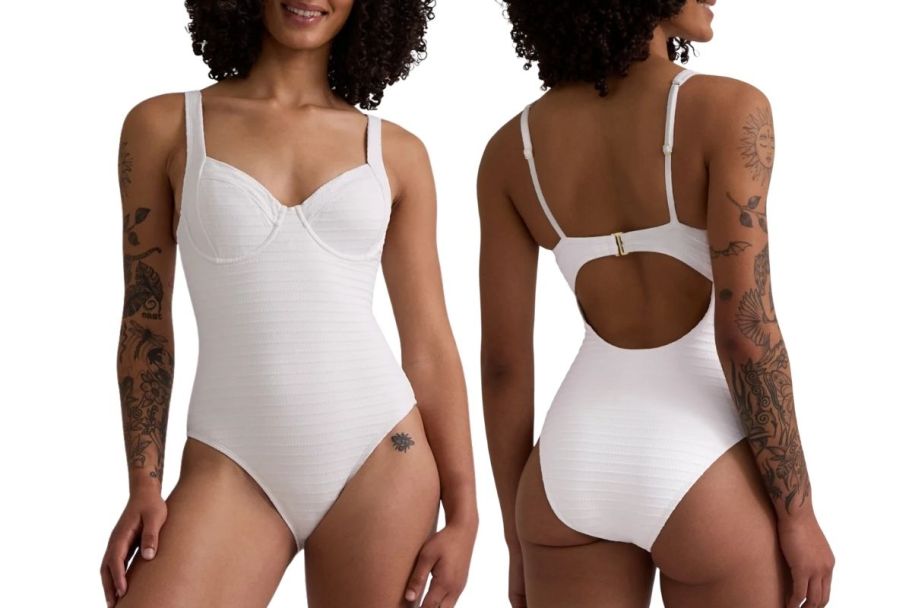 a model in white 1 piece swimsuit