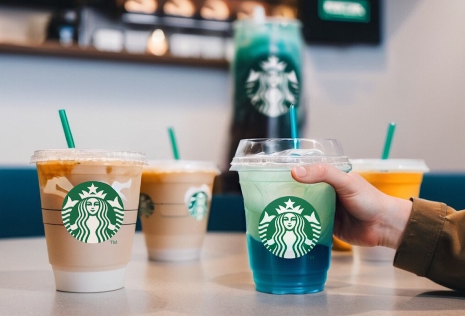 hand holding fake starbucks blue and green drink